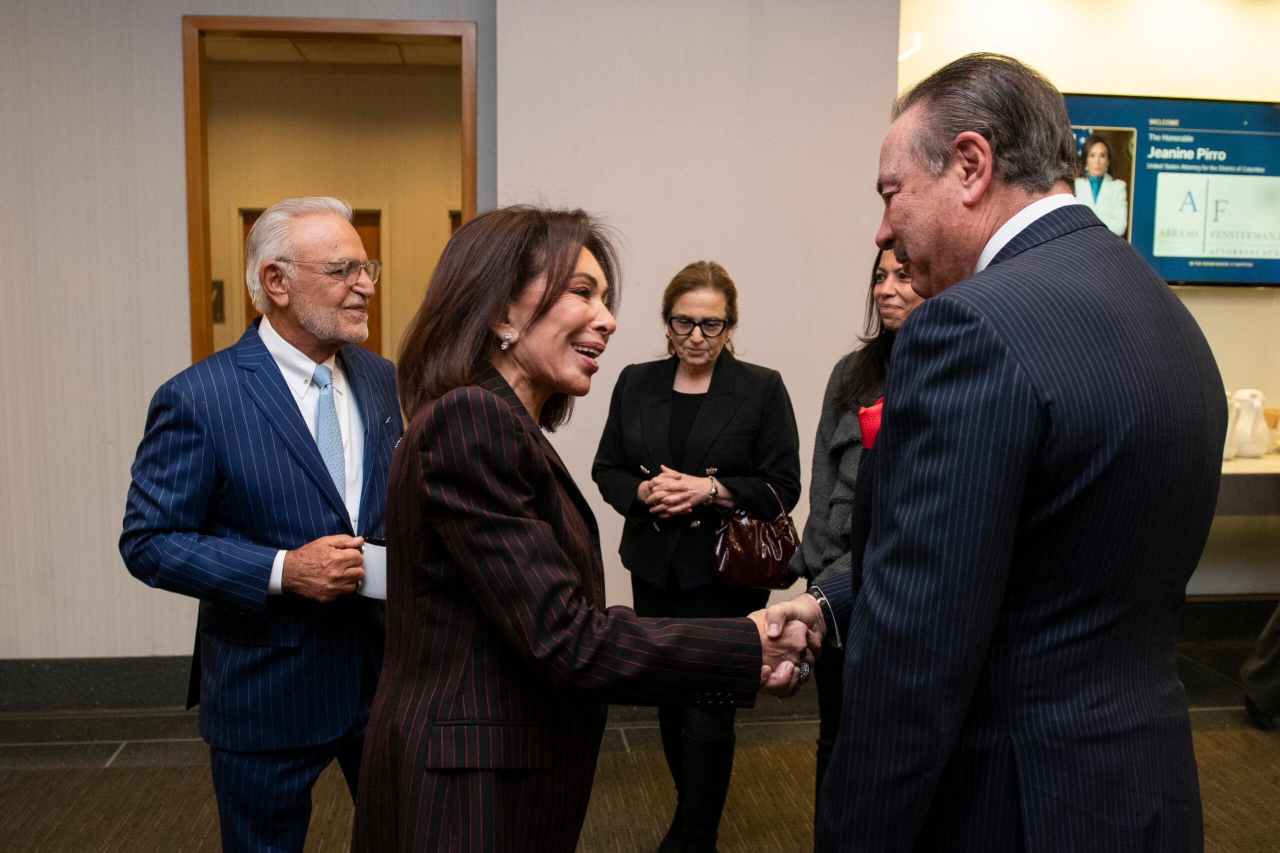 Jeanine Pirro interacting with guests at the event